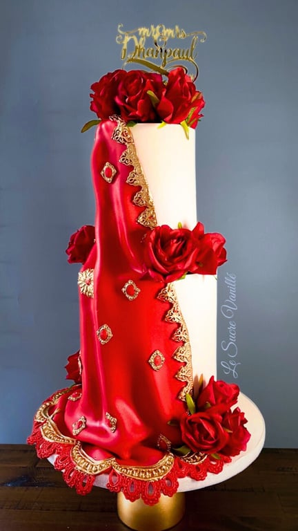 a two tiered sari cake with red roses